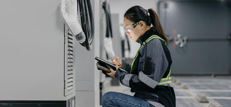 woman, engineer, installing mobile batteries