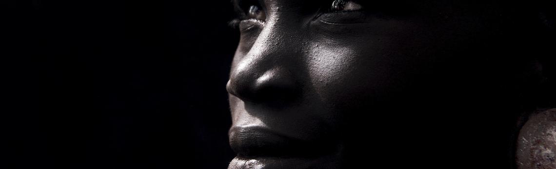 A girl of the Suri tribe in the shadows at the end of the day. Photo by Trevor Cole. A girl of the Suri tribe in the shadows at the end of the day. Photo by Trevor Cole.