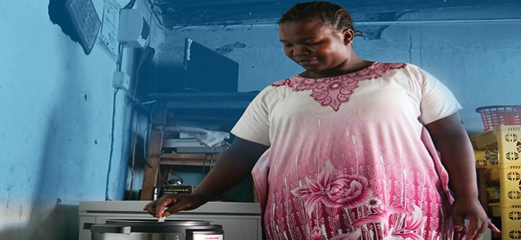 Woman cooking with electrical cooker woman, cooking, africa
